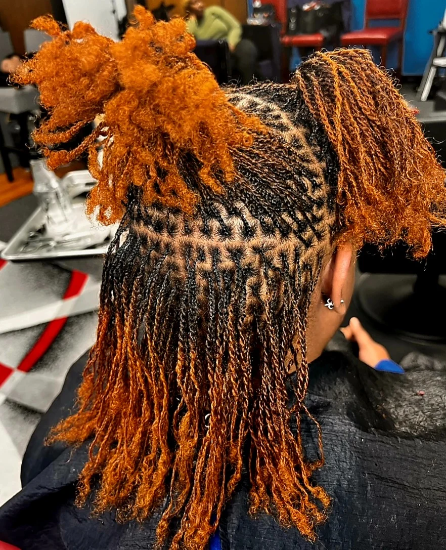 Woman getting her hair braided